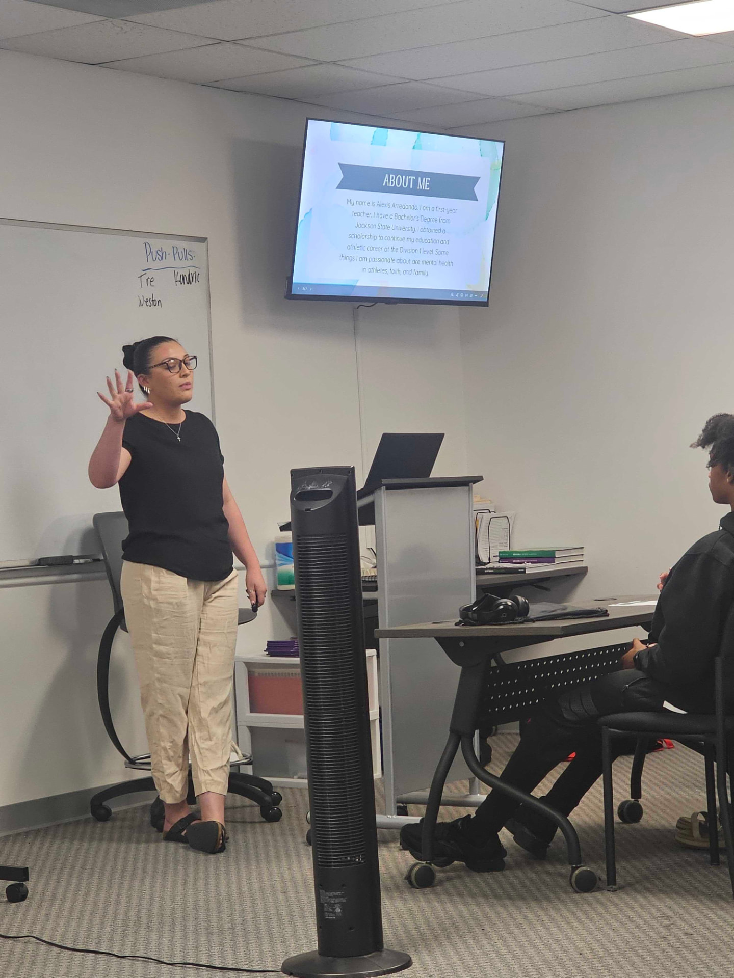 A teacher leading a small-group discussion